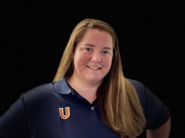 Marissa Hall in blue Utica polo shirt.